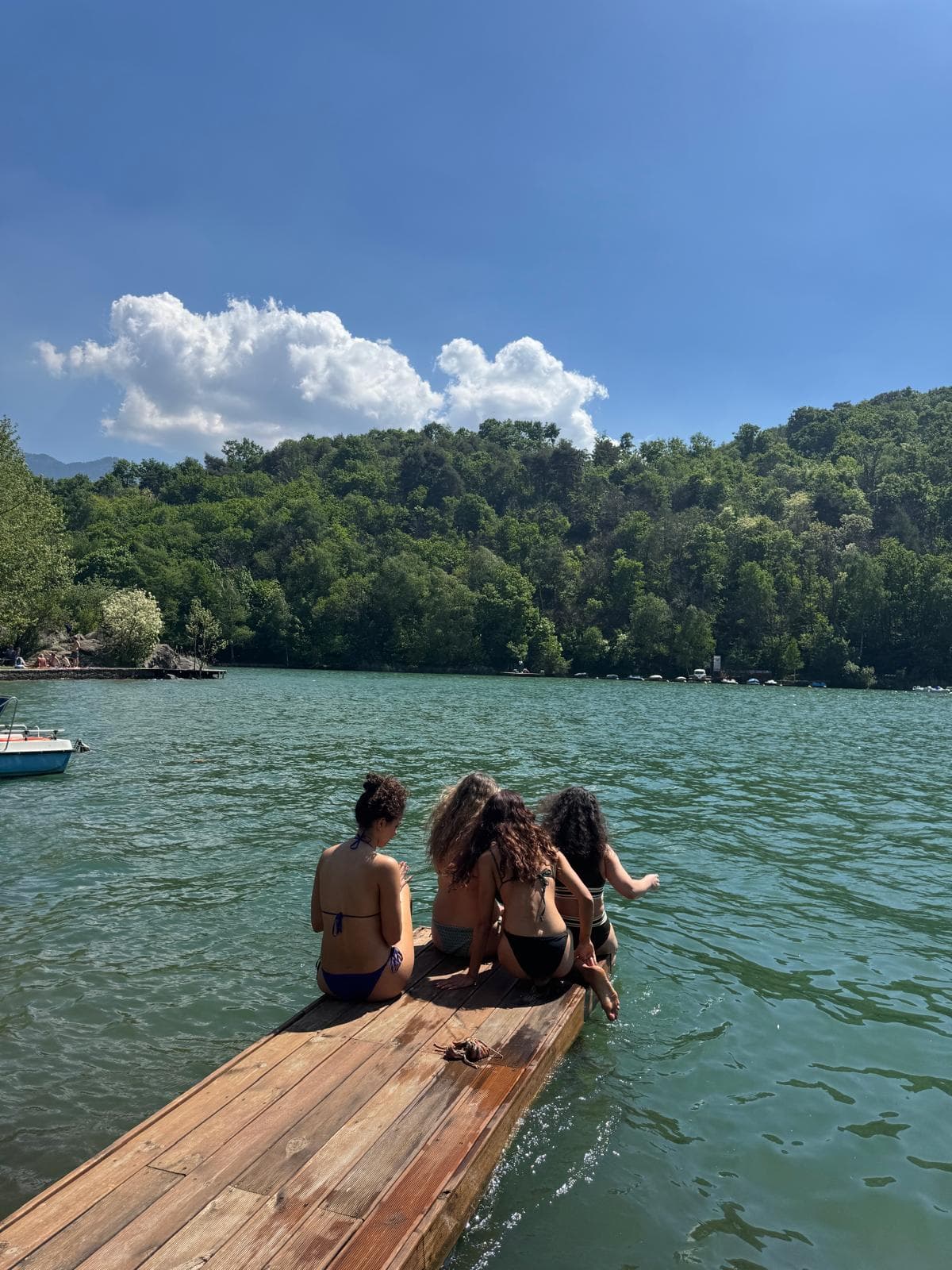 Retreat guests resting together on a wooden pier